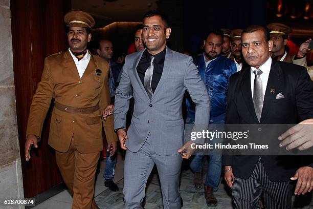 Indian Cricketer MS Dhoni during the wedding reception of Indian Cricketer Yuvraj Singh and Bollywood actor Hazel Keech, at ITC Maurya, on December...