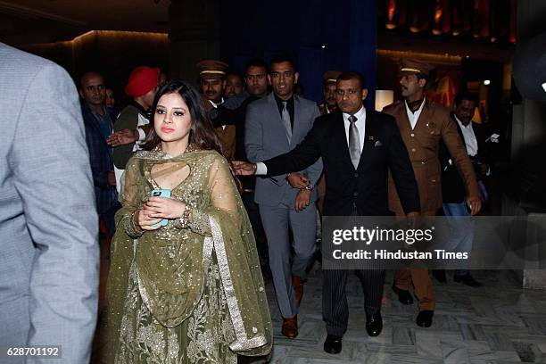 Indian Cricketer MS Dhoni with his wife Sakshi Dhoni during the wedding reception of Indian Cricketer Yuvraj Singh and Bollywood actor Hazel Keech,...