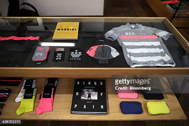 Selection of RCC branded products sit in a display cabinet at the Rapha Racing Ltd. Cycle club in Spitalfields market in London, U.K., on Tuesday,...