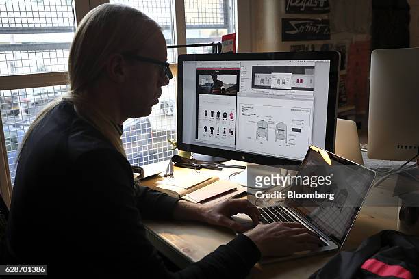Lead designer Graeme Raeburn works on jersey designs on a laptop computer at the Rapha Racing Ltd. Headquarters office in London, U.K., on Thursday,...