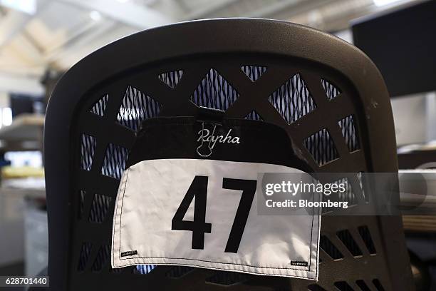 An employee number sits on a mock racing number panel at the Rapha Racing Ltd. Headquarters office in London, U.K., on Thursday, Nov. 10, 2016. To...