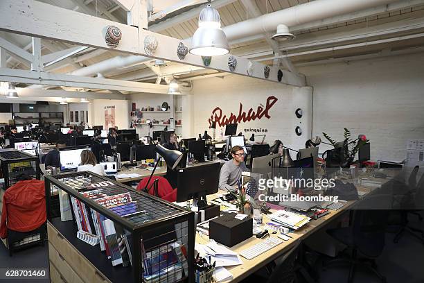 Employees work at computers at the Rapha Racing Ltd. Headquarters office in London, U.K., on Thursday, Nov. 10, 2016. To keep ahead of the...