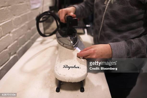 Sample machinist irons a fabric sample in the workshop at the Rapha Racing Ltd. Headquarters office in London, U.K., on Thursday, Nov. 10, 2016. To...