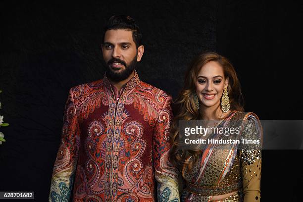 Indian Cricketer Yuvraj Singh with Bollywood actor Hazel Keech during their wedding reception, at ITC Maurya, on December 7, 2016 in New Delhi, India.