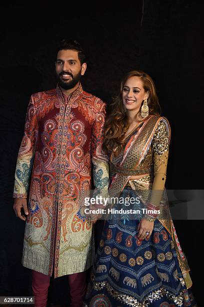 Indian Cricketer Yuvraj Singh with Bollywood actor Hazel Keech during their wedding reception, at ITC Maurya, on December 7, 2016 in New Delhi, India.