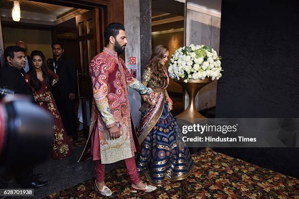 Indian Cricketer Yuvraj Singh with Bollywood actor Hazel Keech during their wedding reception, at ITC Maurya, on December 7, 2016 in New Delhi, India.