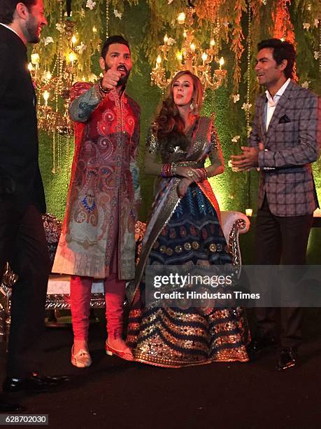 Indian Cricketer Yuvraj Singh with his wife and Bollywood actor Hazel Keech and Cricketer Mohammad Kaif during their wedding reception, at ITC...