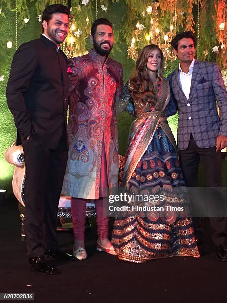 Indian Cricketer Yuvraj Singh with his wife and Bollywood actor Hazel Keech and Cricketer Mohammad Kaif during their wedding reception, at ITC...