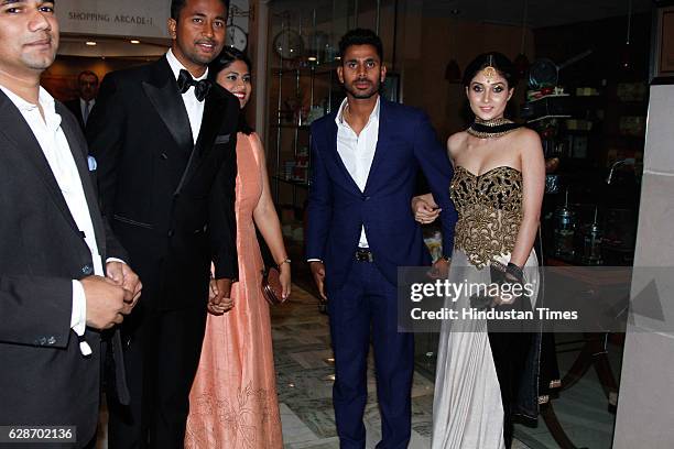 Indian Cricketer Pragyan Ojha with his wife Karabi Baral and Cricketer Manoj Tiwari during the wedding reception of Indian Cricketer Yuvraj Singh and...