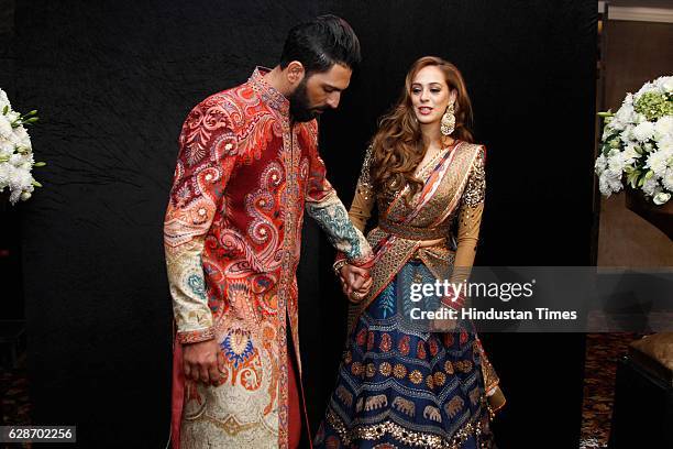 Indian Cricketer Yuvraj Singh with Bollywood actor Hazel Keech during their wedding reception, at ITC Maurya, on December 7, 2016 in New Delhi, India.