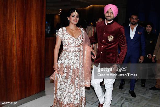 Indian Cricketer Harbhajan Singh with his wife and actor Geeta Basra during the wedding reception of Indian Cricketer Yuvraj Singh and Bollywood...
