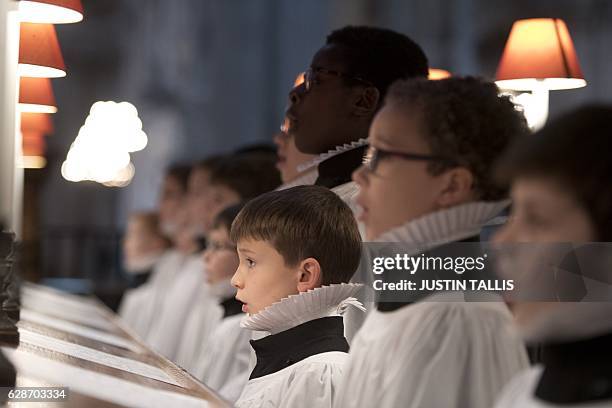 Choristers of St Paul's Cathedral rehearse inside the cathedral in central London on December 9, 2016. The choristers will be performing various...