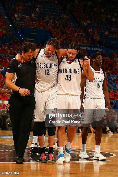 David Anderson of United is assisted from the court with an injury during the round 10 NBL match between the Perth Wildcats and Melbourne United at...