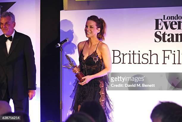 Kate Beckinsale accepts the Best Actress award from Danny Huston at The London Evening Standard British Film Awards at Claridge's Hotel on December...