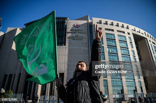 Protester holds a flag with arabic letters and shouts slogans against Israel on December 9, 2016 during a demonstration outside the Istanbul...