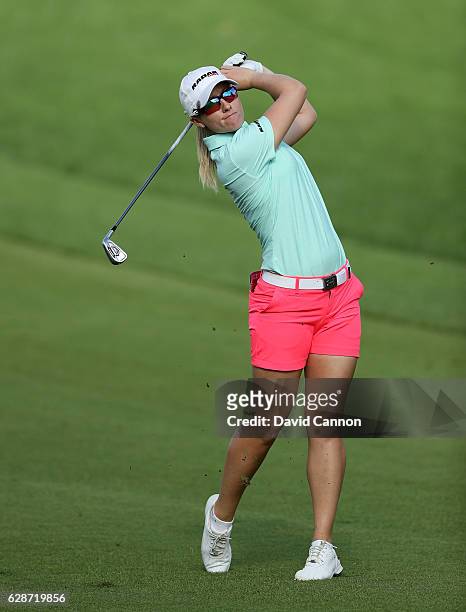 Gwladys Nocera of France plays her second shot at the 14th hole during the delayed second round of the 2016 Omega Dubai Ladies Masters on the Majlis...