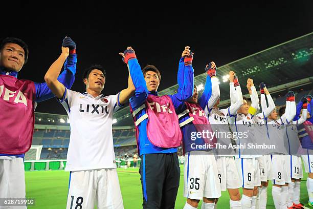 Kashima Antlers players celebrate their 2-1 win after the FIFA Club World Cup Play-off for Quarter Final match between Kashima Antlers and Auckland...