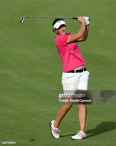 Gwladys Nocera of France plays her second shot at the 14th hole during the delayed second round of the 2016 Omega Dubai Ladies Masters on the Majlis...