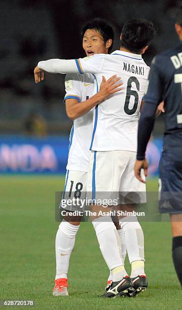 Shuhei Akasaki of Kashima Antlers celebrates scoring his team's first goal with his team mate Ryota Nagaki during the FIFA Club World Cup Play-off...