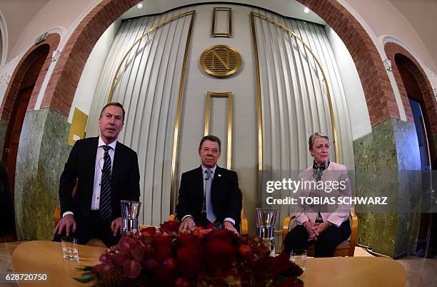 Members of the Nobel committee Olav Njoelstad and Berit Reiss-Andersen and Nobel Peace Prize laureate Colombian President Juan Manuel Santos attend a...
