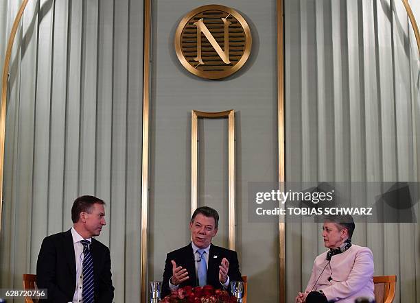 Members of the Nobel committee Olav Njoelstad and Berit Reiss-Andersen and Nobel Peace Prize laureate Colombian President Juan Manuel Santos attend a...