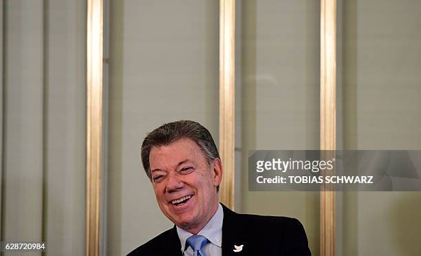 Nobel Peace Prize laureate Colombian President Juan Manuel Santos smiles as he addresses a press conference in Oslo on December 9, 2016. Santos said...