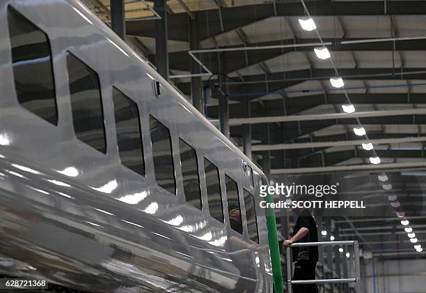 Employees work on the Hitachi Intercity Express Programme train production line at Hitachi's manufacturing plant in Newyton Aycliffe, north-east...