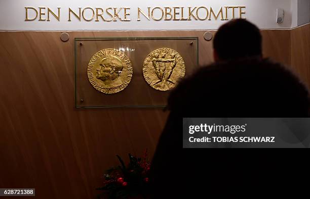 Journalist enters the Nobel Institute before a news conference of the 2016 Nobel Peace prize laureate in Oslo on December 9, 2016. / AFP / TOBIAS...