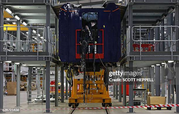 Employees work on the Hitachi Intercity Express Programme train production line at Hitachi's manufacturing plant in Newyton Aycliffe, north-east...