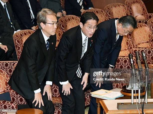 Nobuteru Ishihara, Japan's minister in charge of economic revitalization, Foreign Minister Fumio Kishida and farm minister Yuji Yamamoto bow at an...