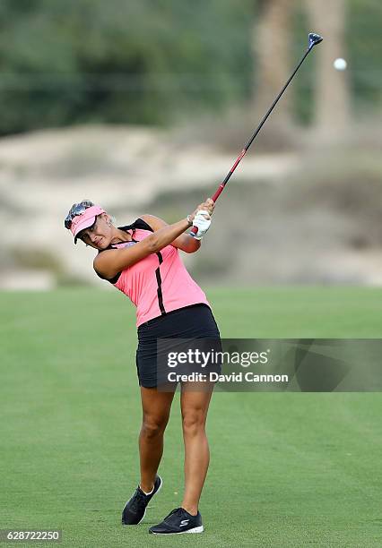 Amy Boulden of Wales plays her second shot at the 14th hole during the delayed second round of the 2016 Omega Dubai Ladies Masters on the Majlis...