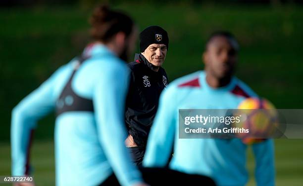 Slaven Bilic of West Ham United watches on during training at Rush Green on December 9, 2016 in Romford, England.