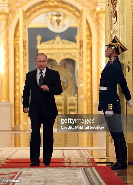 Russian President Vladimir Putin arrives to speak during a reception marking the Heroes of the Farherland's Day at the Grand Kremlin Palace on...