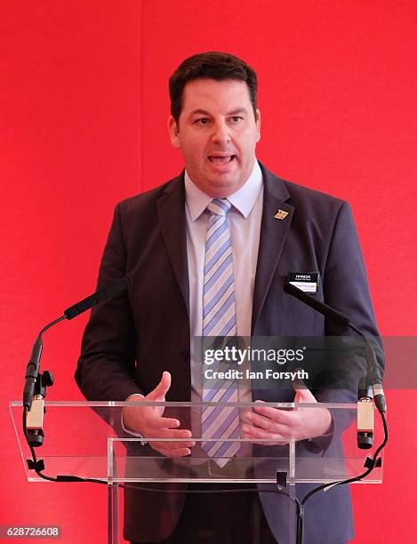 Minister for the Northern Powerhouse, Andrew Percy MP, speaks to guests during a visit to the Hitachi Rail Europe site on December 9, 2016 in Newton...