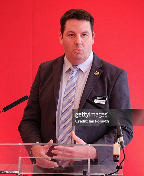 Minister for the Northern Powerhouse, Andrew Percy MP, speaks to guests during a visit to the Hitachi Rail Europe site on December 9, 2016 in Newton...