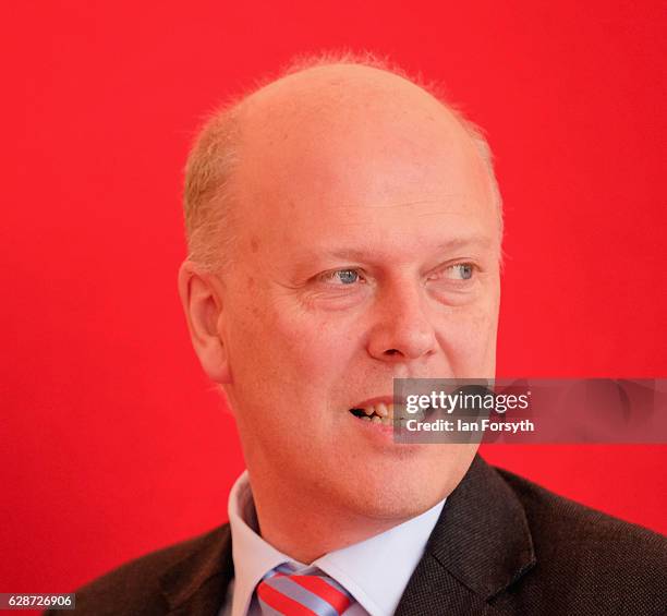 Secretary of State for Transport Chris Grayling MP speaks to guests as he visits the Hitachi Rail Europe site on December 9, 2016 in Newton Aycliffe,...