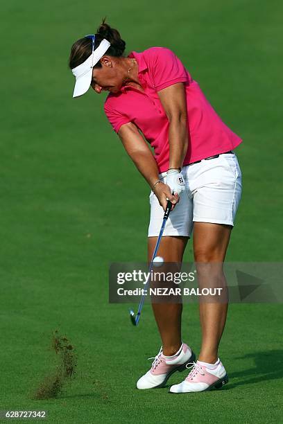 Gwladys Nocera of France plays a shot during the third round of the Dubai Ladies Masters at the Emirates Golf Club on December 9 in Dubai. / AFP /...