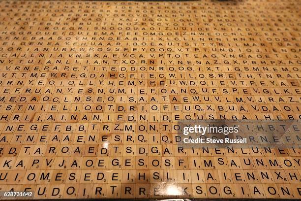 Thousands of scrabble tiles make up the entire bar, hidden in the tiles are the names of 55 literary characters. Marlene Thorne and hey literary cafe...