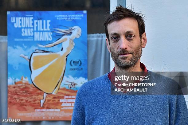 French animation film designer Sebastien Laudenbach poses outside his workshop in Paris on November 30, 2016. "The young woman without hands" is the...