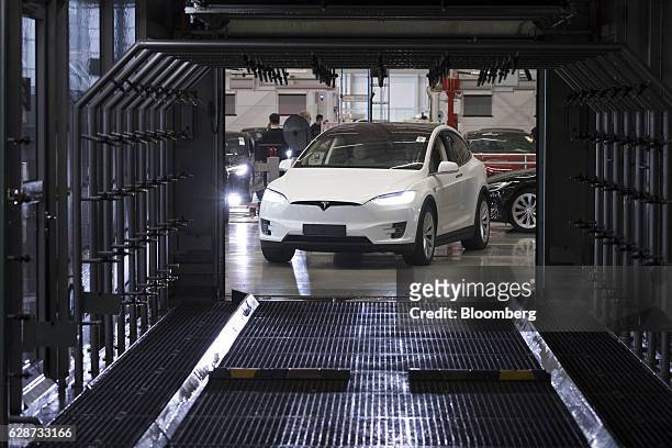 Tesla Model X sports utility vehicle drives into a rain testing chamber during assembly for the European market at the Tesla Motors Inc. Factory in...