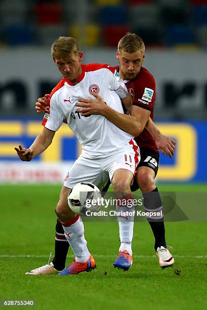 Hannmo Behrens of Nuernberg challenges Axel Bellinghausen of Duesseldorf during the Second Bundesliga match between Fortuna Duesseldorf and 1. FC...