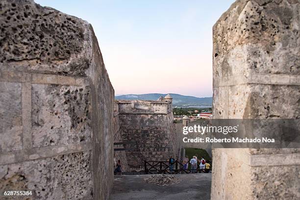 Afternoon sunset at the San Pedro of the Rock Castle or El Morro de Santiago de Cuba. The fortress was declared a World Heritage Site by UNESCO in...