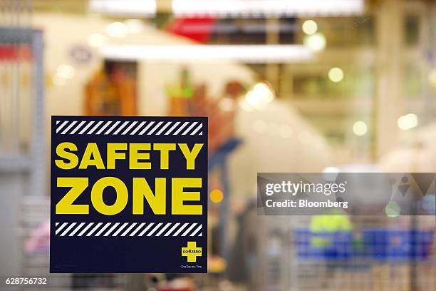 Safety Zone" sign hangs at the Boeing Co. Final assembly facility in North Charleston, South Carolina, U.S., on Tuesday, Dec. 6, 2016. On the day...