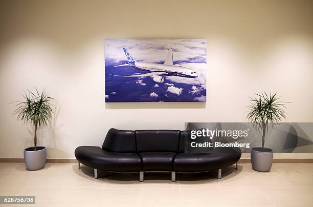 Photograph hangs above a couch at the Boeing Co. Final assembly facility in North Charleston, South Carolina, U.S., on Tuesday, Dec. 6, 2016. On the...