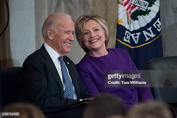 Vice President Joe Biden and former Secretary of State Hillary Clinton attend a portrait unveiling ceremony for retiring Senate Minority Leader Harry...