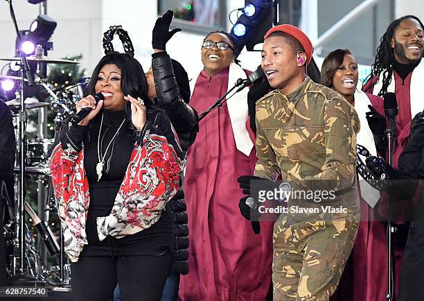 Gospel singer Kim Burrell and singer/songwriter Pharrell Williams perform on NBC's "Today" at Rockefeller Center on December 9, 2016 in New York City.