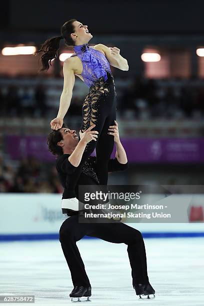 Tessa Virtue and Scott Moir of Canada compete during Senior Ice Dance Short Dance on day two of the ISU Junior and Senior Grand Prix of Figure...