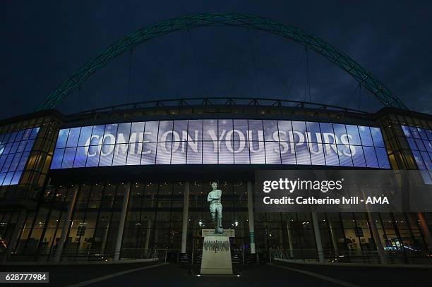 The Bobby Moore statue in front of a come on your spurs sign outside Wembley stadium ahead of the UEFA Champions League match between Tottenham...