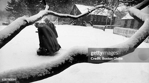 Visitors move through snow at Old Sturbridge Village in Sturbridge, Mass., 1983. [Date estimated to year]