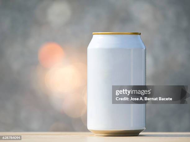 beverage  refreshment tinned, illuminated by the light of the sun - estaño fotografías e imágenes de stock